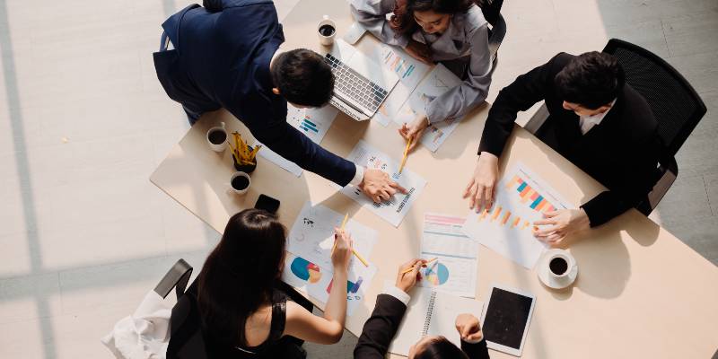 Group of people is discussing something on a table